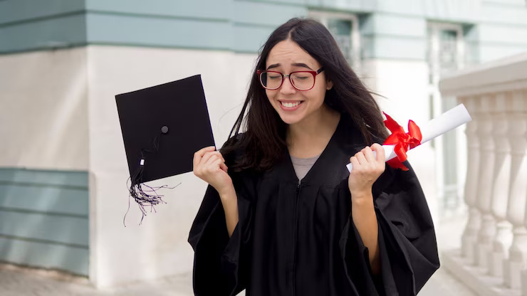 A girl laughing after getting graducation degree